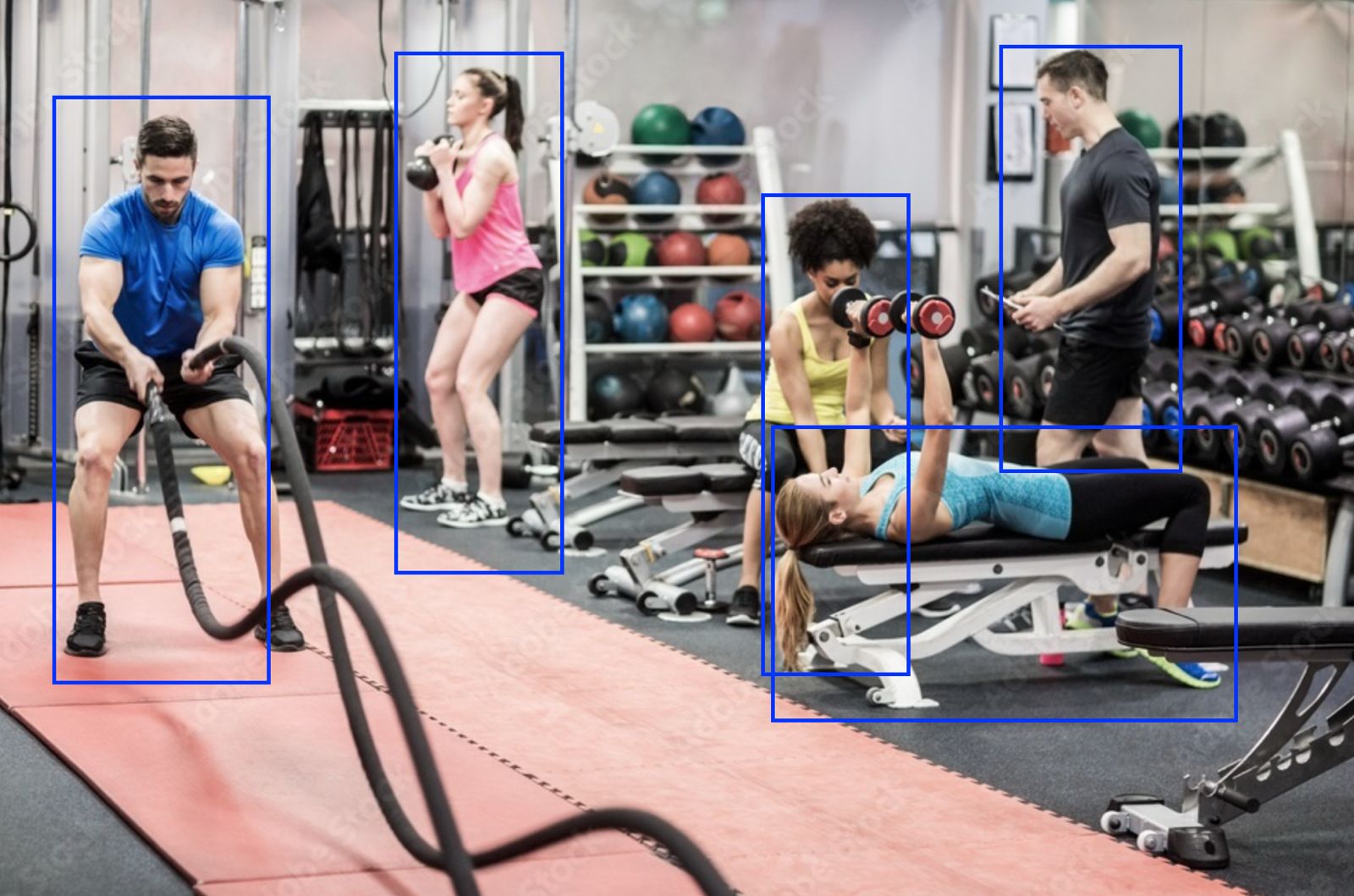 Members using equipment in a gym